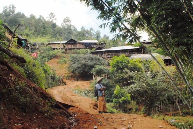 Our guide, Sai Leng, leads us up to our first home visit.