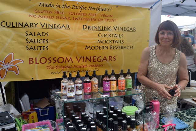 Connie Rawlings-Dritsa of Blossom Vinegars with her flavored vinegars.